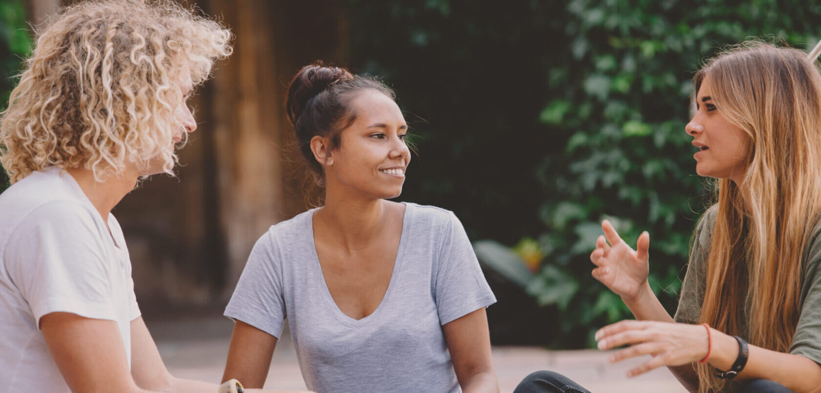 Background image of students in discussion